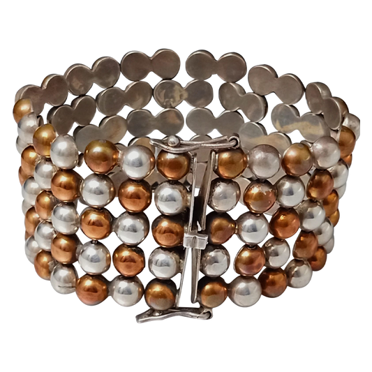 Pulsera de media perla de cobre